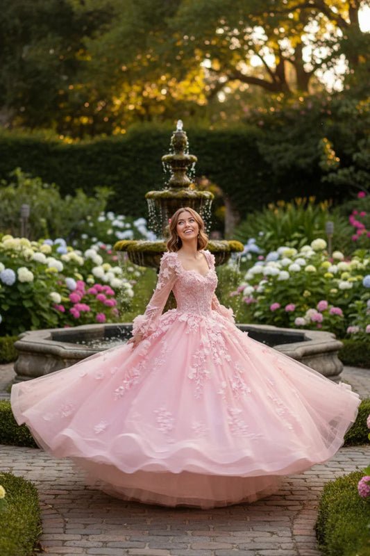 Woman in a pink long sleeve ball gown with floral lace, twirling near a garden fountain